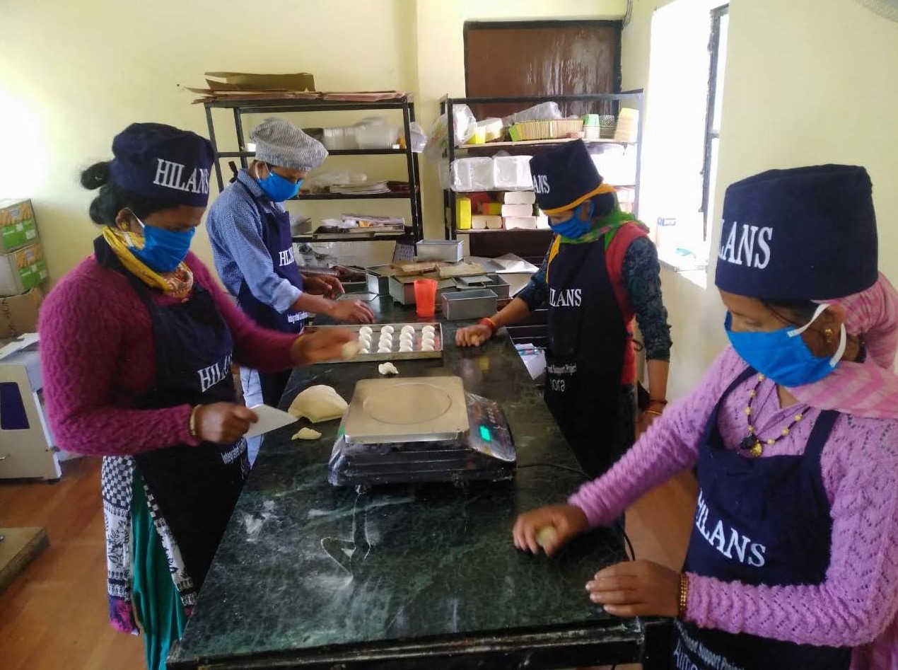 Members of Pragati federation bake during the lockdown, photo credit Kavita Bisht